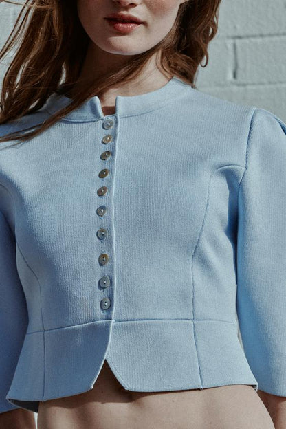 Veste en maille à manches bouffantes