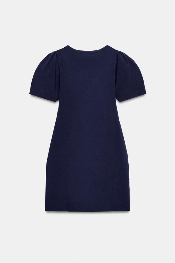 Robe courte en maille à manches bouffantes