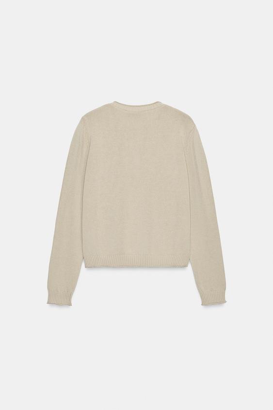 Veste en maille à boutons métalliques