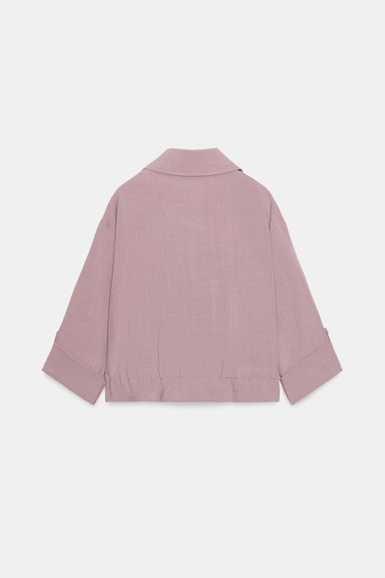 Veste courte à manches retroussées