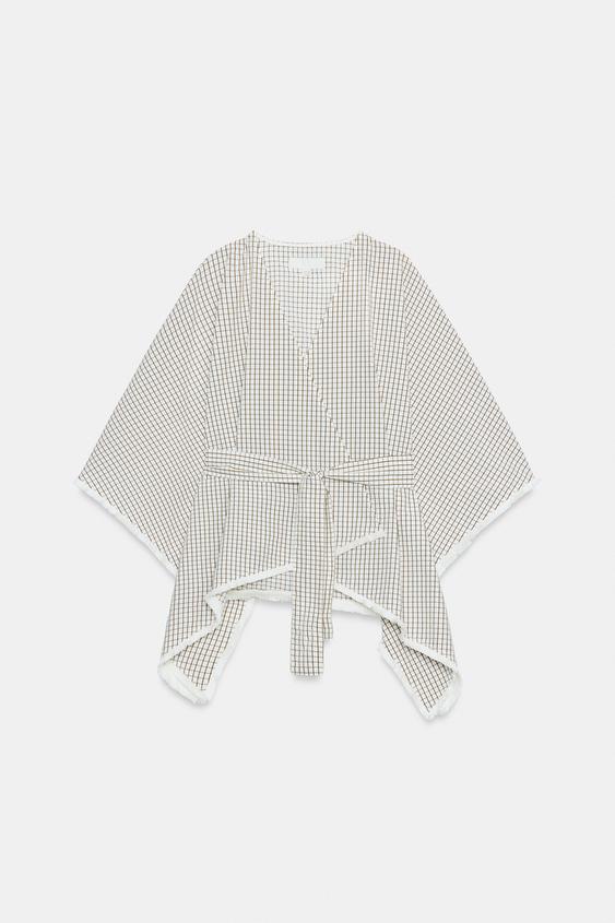 Gilet à carreaux effiloché