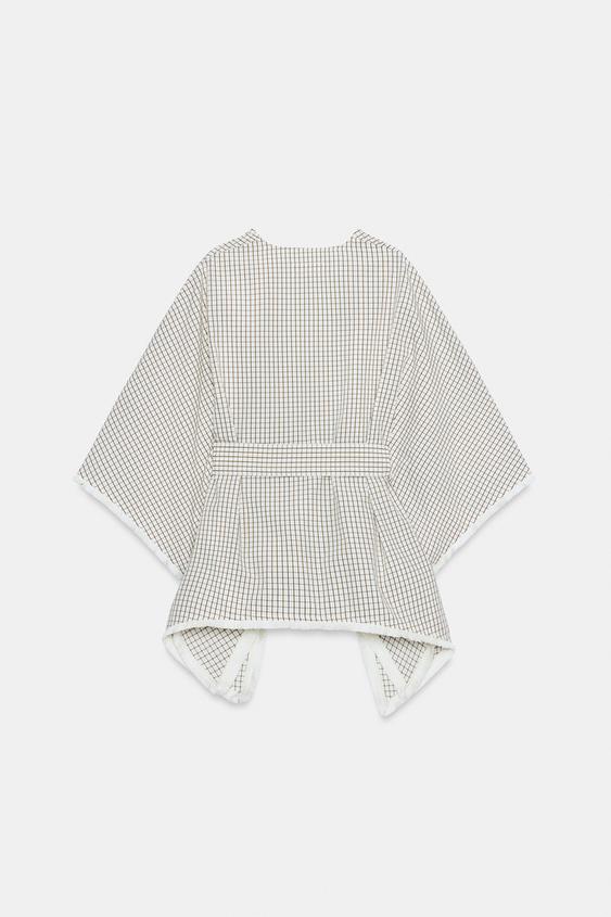 Gilet à carreaux effiloché