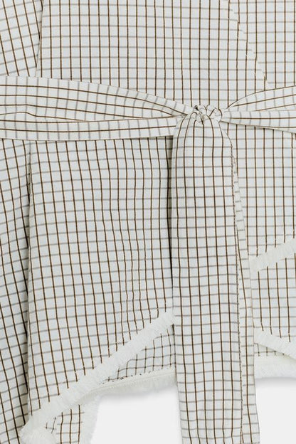 Gilet à carreaux effiloché