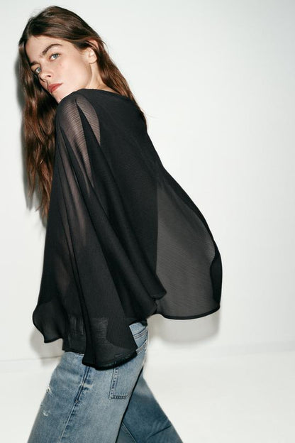 Blouse contrastée effet cape