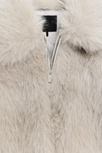 Manteau court effet fourrure à fermeture zippée