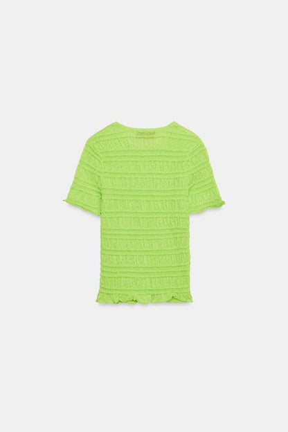 Veste en maille smockée