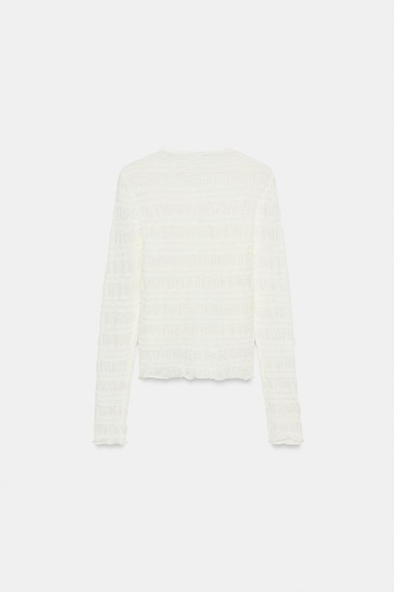 Veste en maille smockée