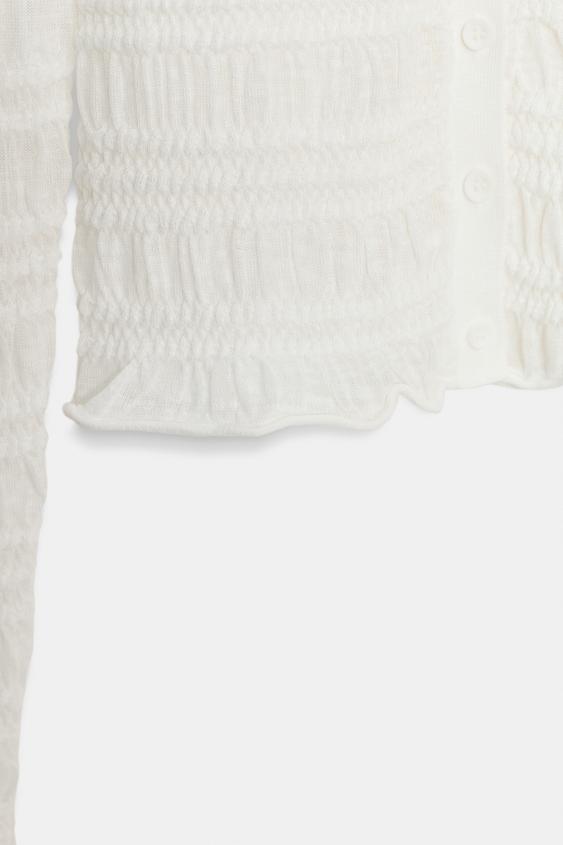 Veste en maille smockée