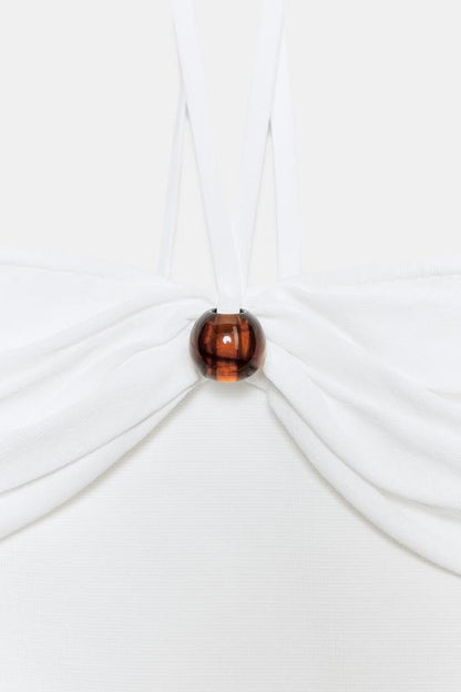 Top bandeau en maille à détail boule