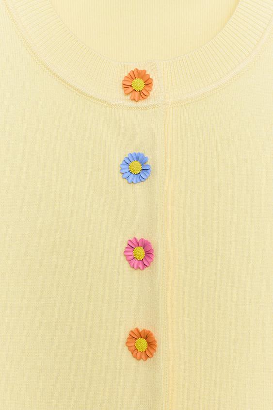 Veste en maille à boutons fleur