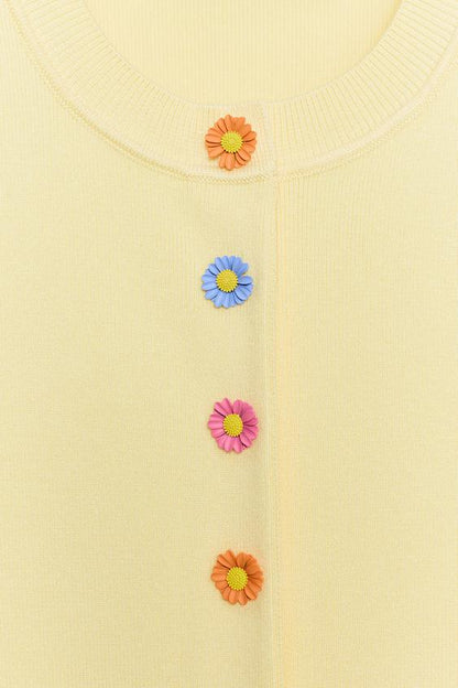 Veste en maille à boutons fleur