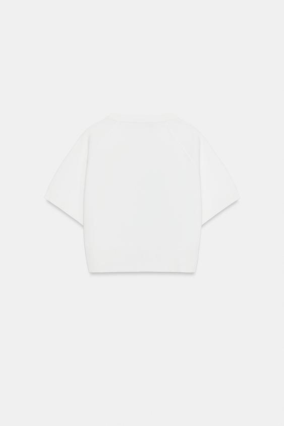 Veste courte en maille à fermeture zippée