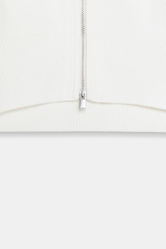 Veste courte en maille à fermeture zippée