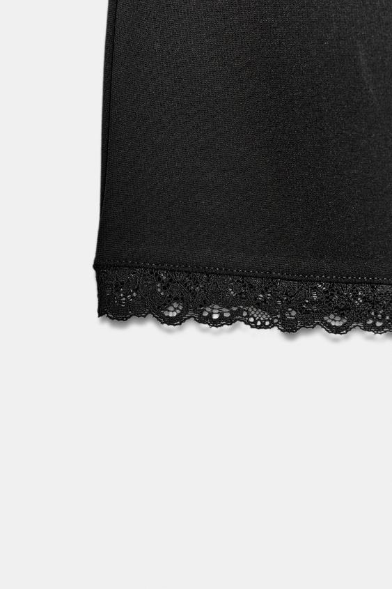 Jupe mini extensible en dentelle