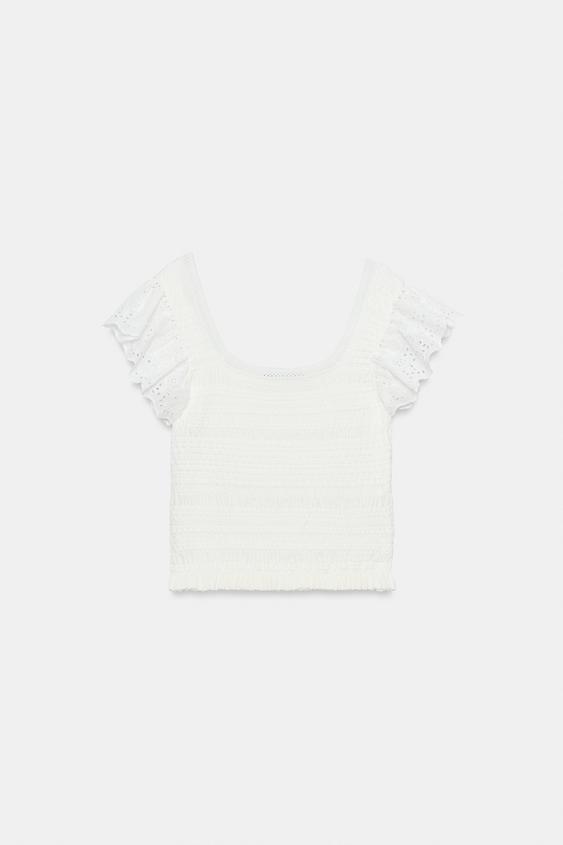 Top en maille à broderies ajourées