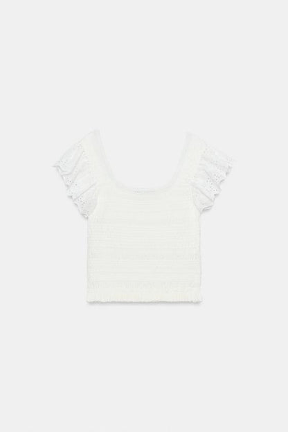 Top en maille à broderies ajourées