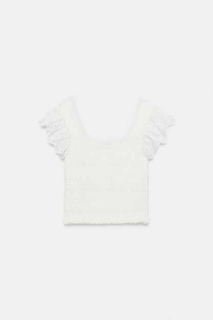Top en maille à broderies ajourées