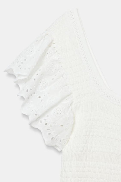 Top en maille à broderies ajourées