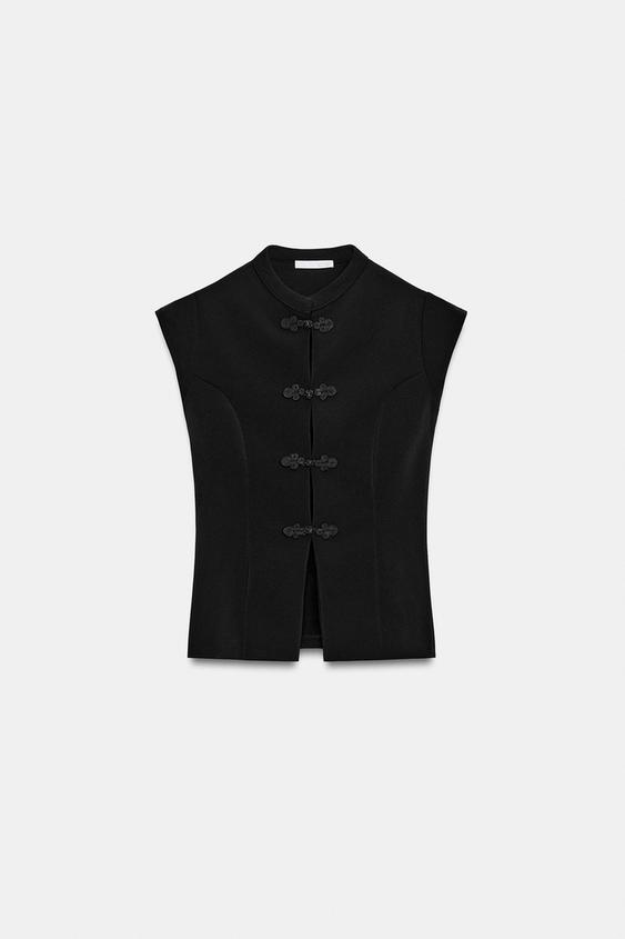 Top extensible à brandebourgs