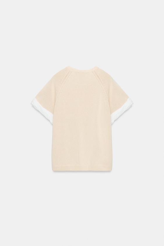 Pull en maille à manches contrastées avec revers