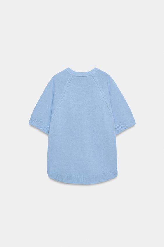 Pull en maille à bas arrondi et manches courtes