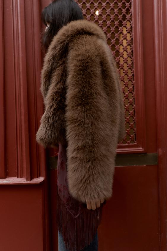 Manteau court effet fourrure