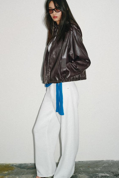 Blouson effet cuir à capuche