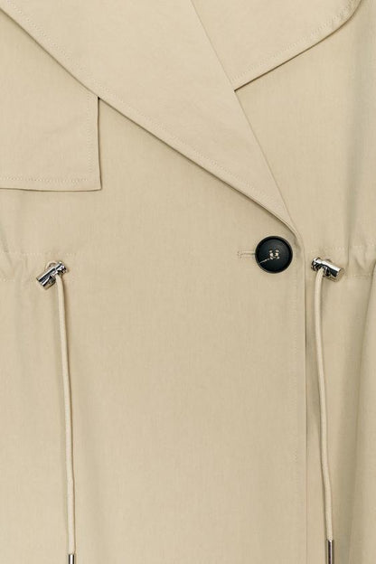 Trench court taille réglable