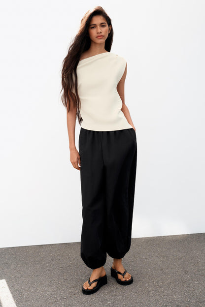 Top asymétrique en maille