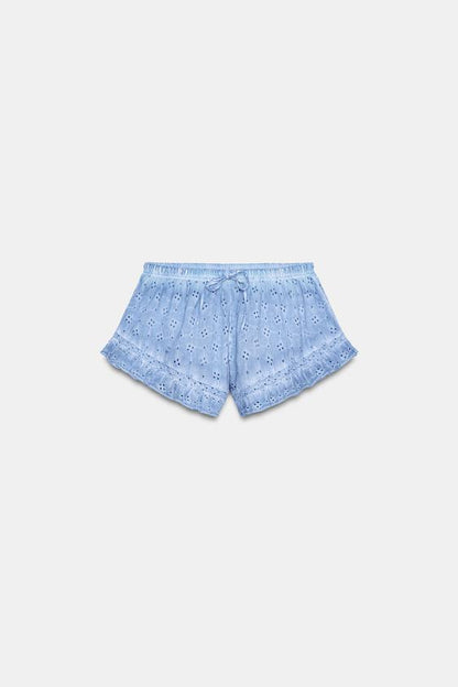 Short effet délavé à broderies ajourées