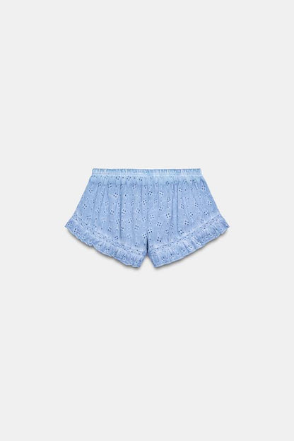 Short effet délavé à broderies ajourées