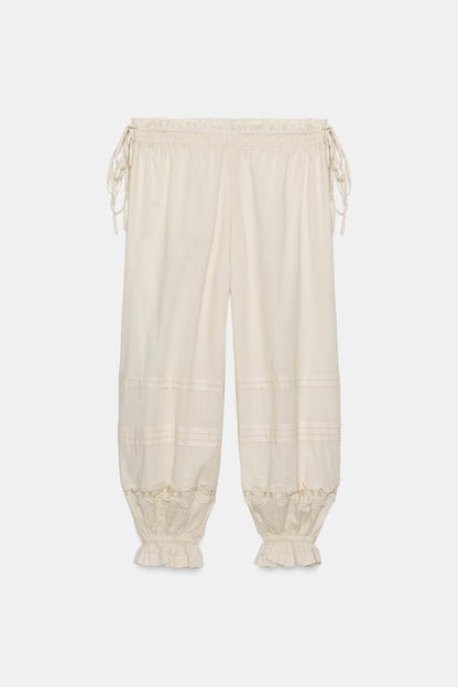 Pantalon bouffant à plis en dentelle