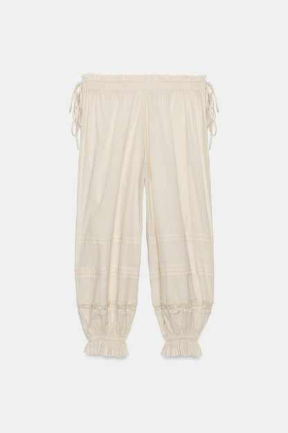 Pantalon bouffant à plis en dentelle
