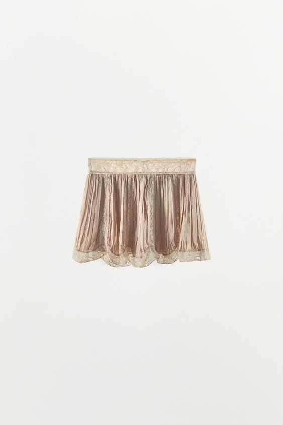 Jupe mini plissée en dentelle à perles