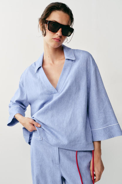 Blouse en lin à détails passepoilés