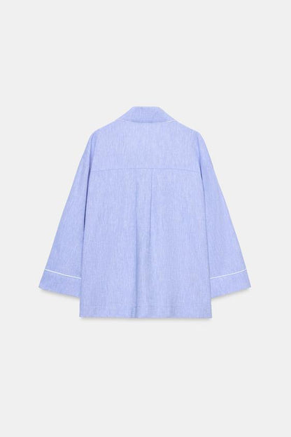Blouse en lin à détails passepoilés