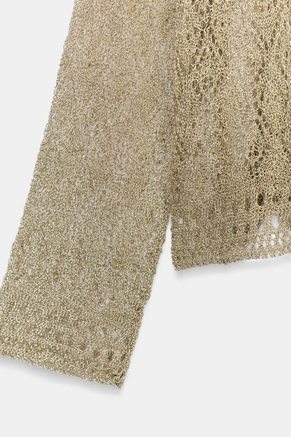 Pull en maille pointelle à fil métallisé