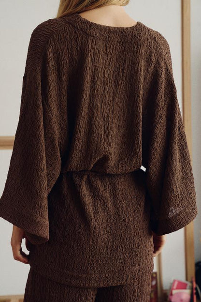 Veste avec ceinture effet froissé