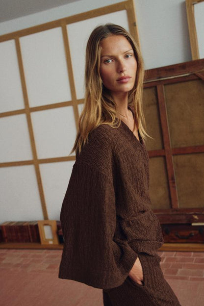 Veste avec ceinture effet froissé
