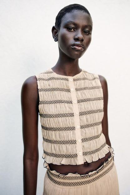 Top façon gilet à coutures contrastées