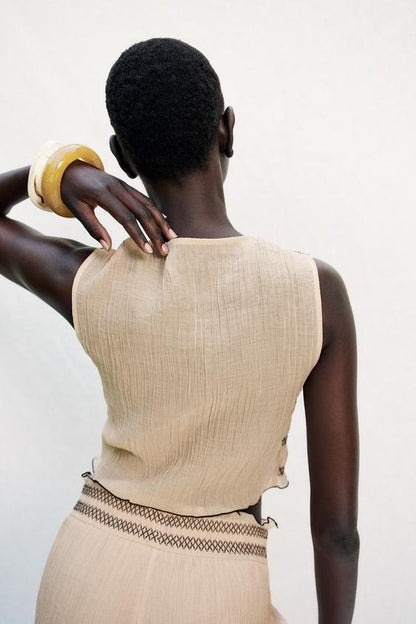 Top façon gilet à coutures contrastées