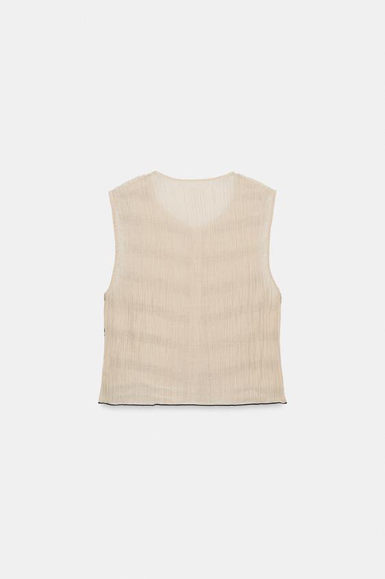 Top façon gilet à coutures contrastées
