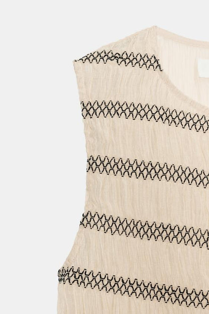 Top façon gilet à coutures contrastées