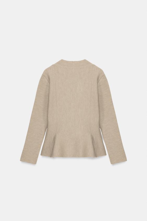 Veste en maille peplum